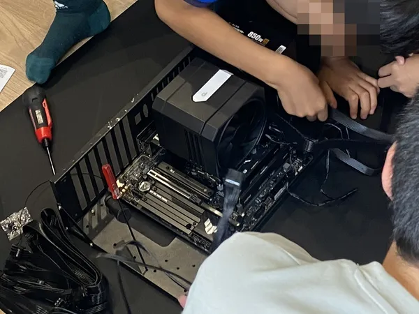 Children assembling a desktop PC