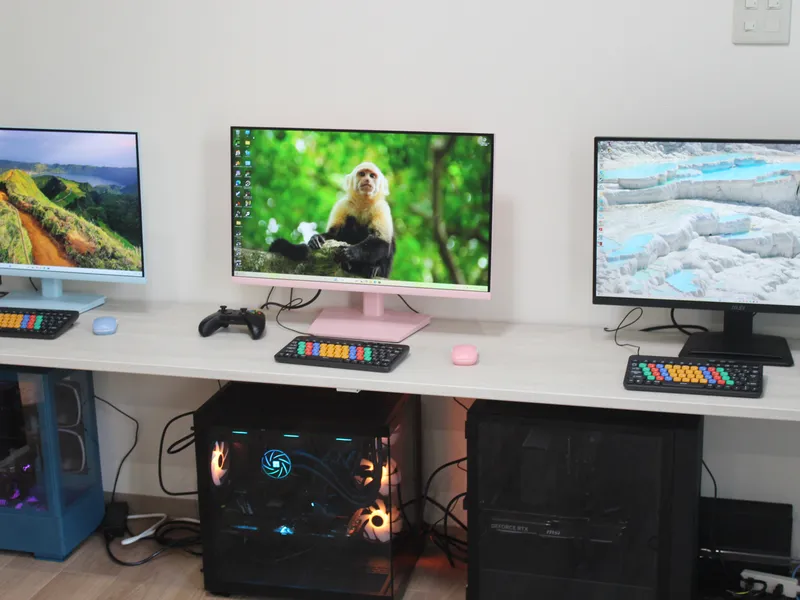 A row of gaming PCs and monitors at our center