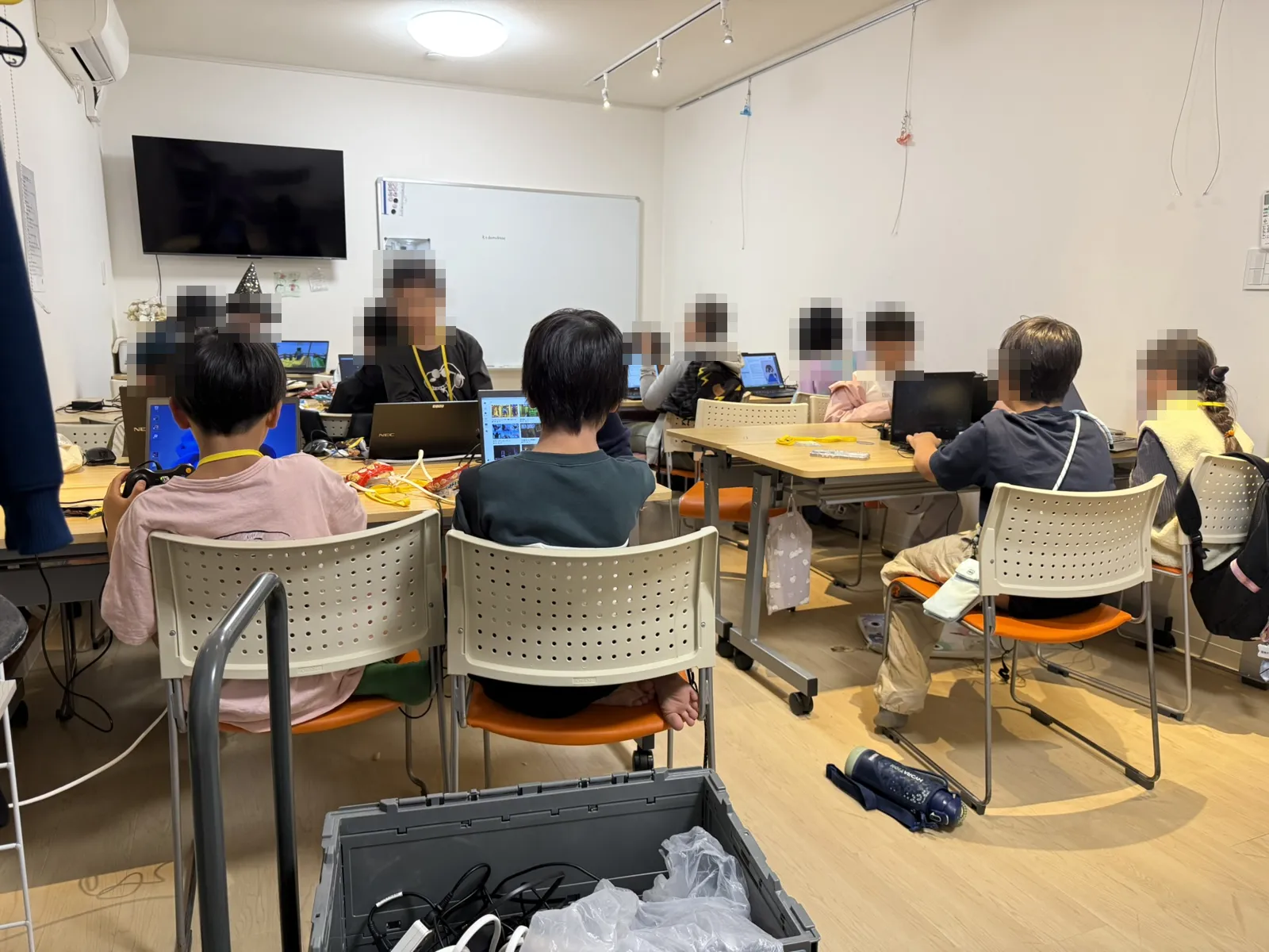 Children at Houkago Lab, each working on a laptop